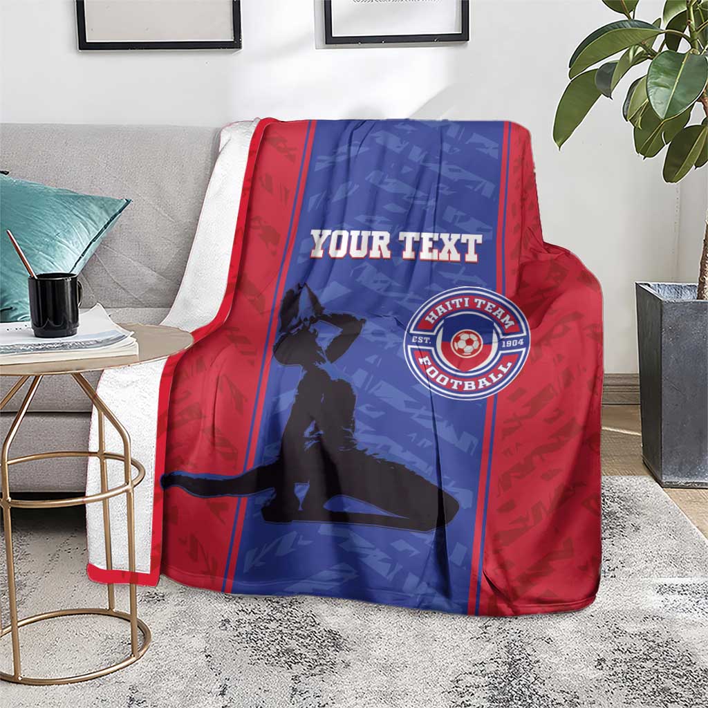 Red and blue football blanket with custom text and Haiti football crest, on chair and floor