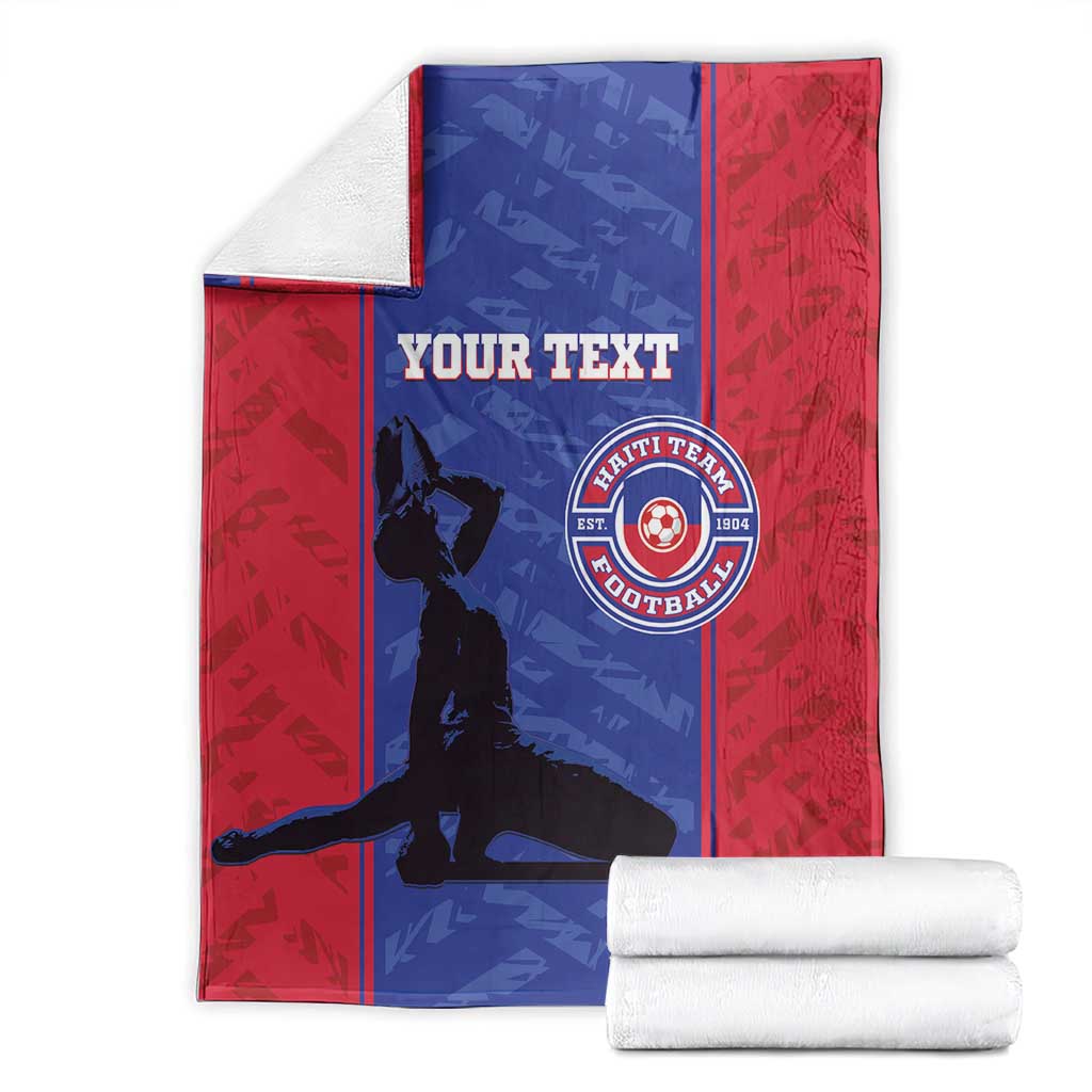 Red and blue football blanket with custom text and Haiti football crest, folded with stacks