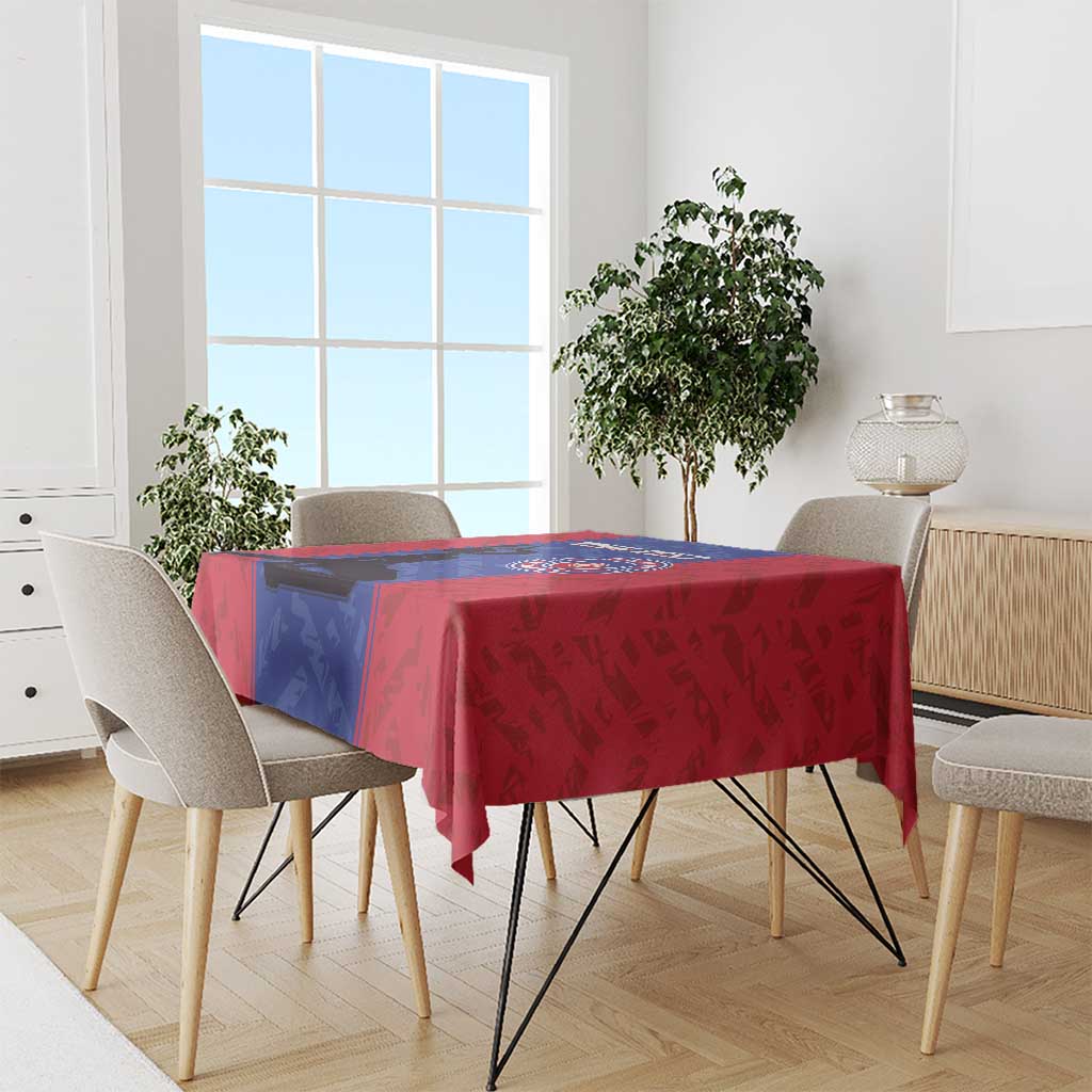 Custom football tablecloth draped on dining table, red fabric with blue stripe and crest design.