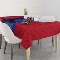 Custom football tablecloth on dining table with red side pattern, blue panel, and crest logo.