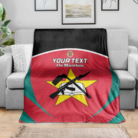 Red football blanket with black and teal border, crest and emblem print, draped on sofa