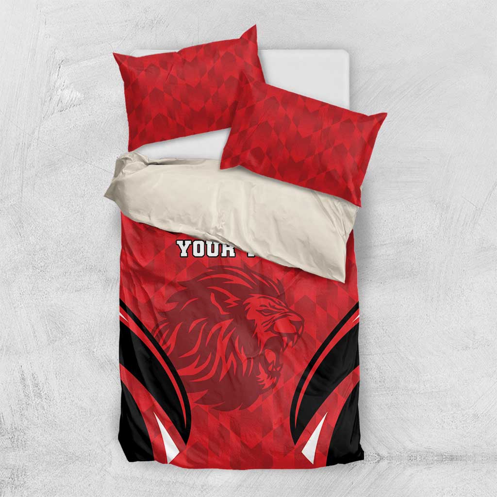 Red football bedding set with lion emblem, black stripes, and two coordinated pillowcases