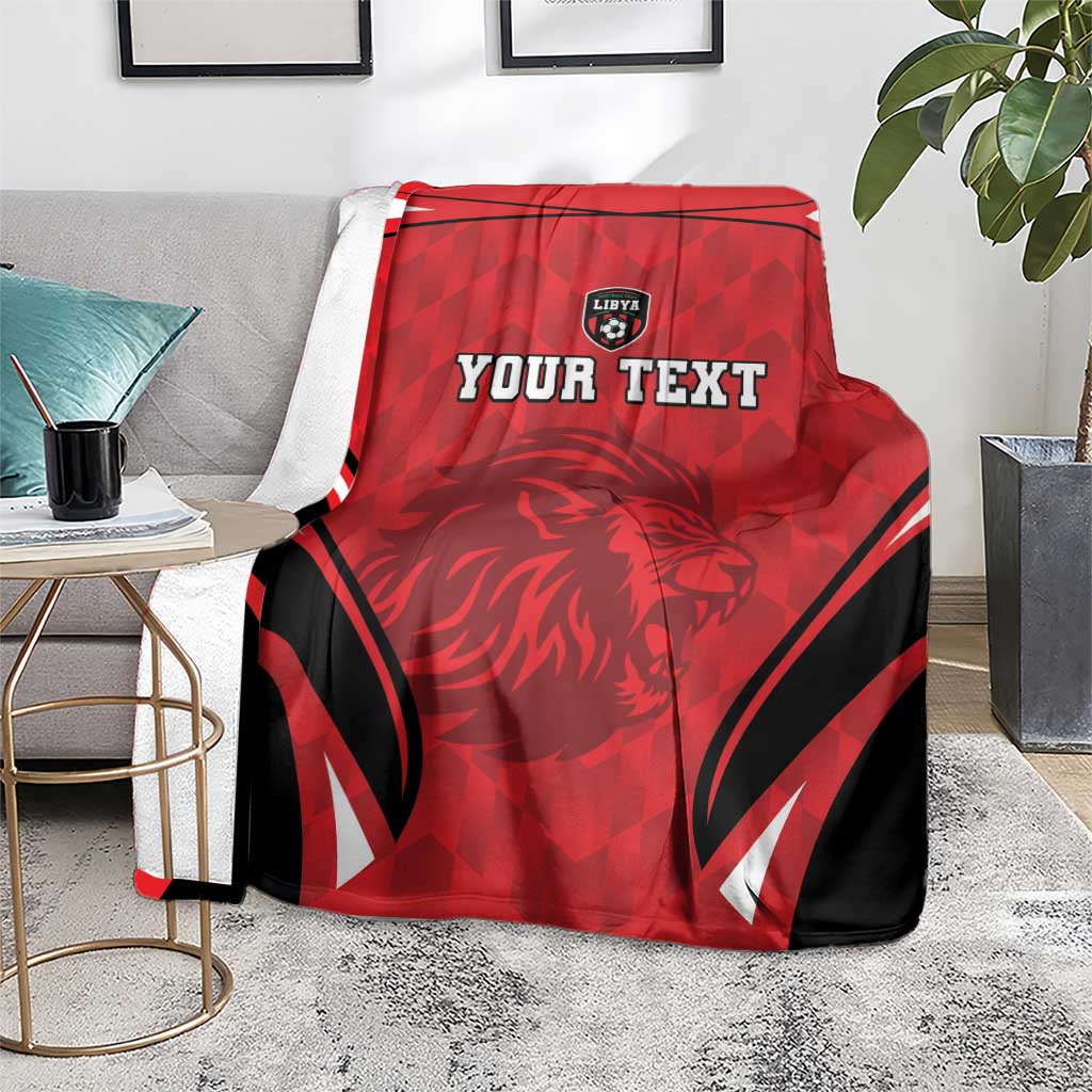 Red and black football blanket with lion face and 'YOUR TEXT' design, partially draped