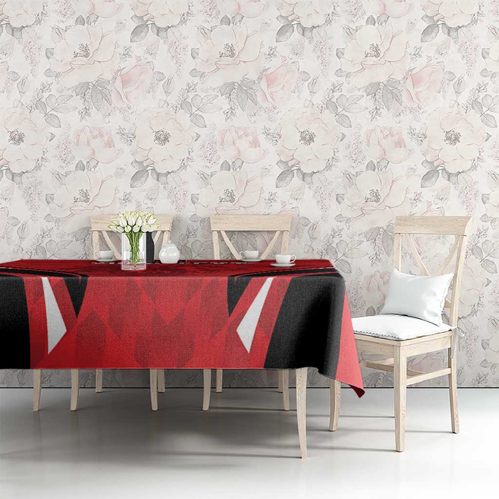 Red and black football tablecloth with angular graphics covering a dining table