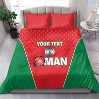 Red and green cricket-themed bedding set with two pillows on a bed.