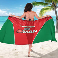 Red and green polka-dot cricket sarong with custom text and team graphic, held open