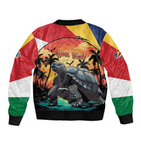 Colorful bomber jacket with large tortoise sunset print and black ribbed hem and cuffs