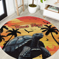 Round beach carpet with giant tortoise, palm trees and sunset 'Your Text' print.