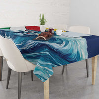 Rectangular tablecloth with blue wave motif and sailfish illustration on tabletop