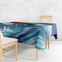 Tablecloth edge on wooden bench, teal-blue wave design with navy corner section