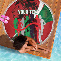 Round red beach blanket with fringe, runners graphic and 'YOUR TEXT' in the center.