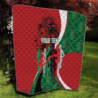 Red quilted personalized throw blanket with green-and-white arc design and runner silhouette