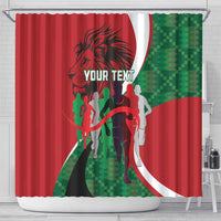 Red shower curtain with athlete silhouettes, curved white arc, lion head, and green panel