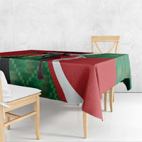 Red and green athletics tablecloth with white diagonal accents and hanging corners