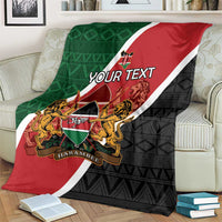Personalised Kenya blanket blanket spread on couch; red top, black bottom, green side panel, coat of arms