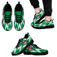 Green lace-up football sneakers set, black sole and crest emblem