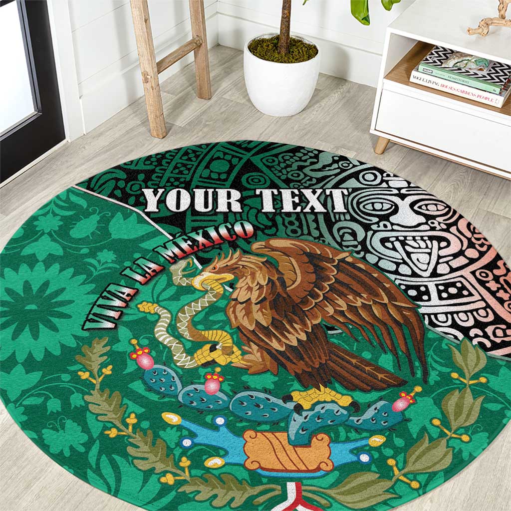 Green round area rug with eagle, cacti, and Aztec-style geometric border design