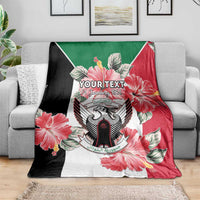 Personalized blanket coat with floral crest design in green, red, and black