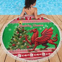 Round green beach blanket with Welsh dragon by Christmas tree, fringed edge