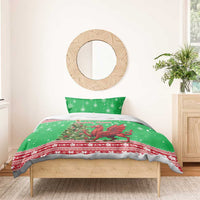 Green Christmas bedding set on bed: dragon graphic duvet cover with matching pillowcase