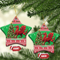 Green star-shaped ceramic Christmas ornament with red Welsh dragon and patterned border.