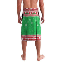 Green Christmas lavalava with snowy print, red trim, and geometric border pattern