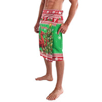 Green Christmas lavalava with red border, Welsh text panel, and dragon-and-tree scene