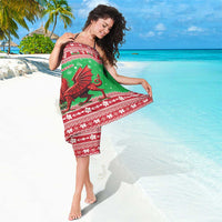 Green and red Christmas sarong featuring Welsh dragon motif and festive border
