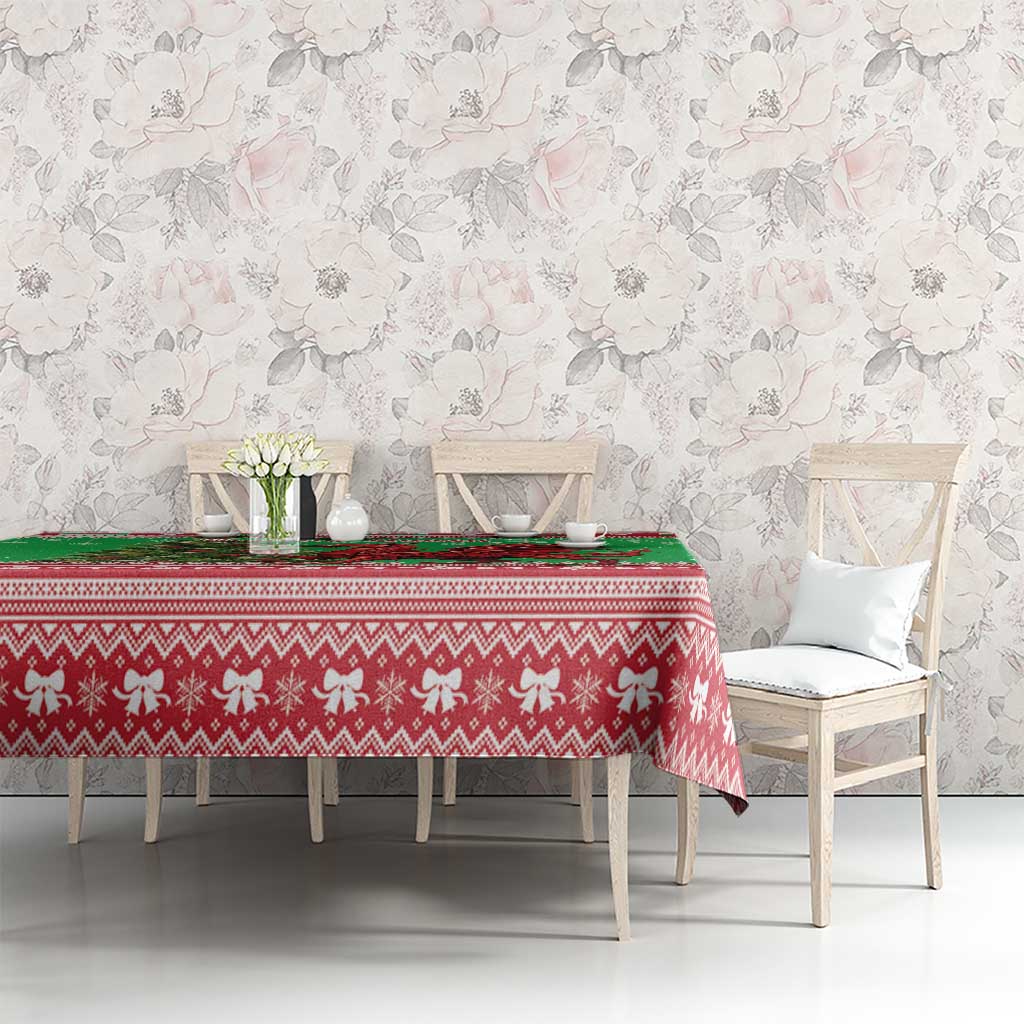 Green holiday tablecloth with red border pattern and dragon motif on dining table