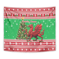 Green Christmas tapestry showing red dragon, holly tree, and layered Welsh-style borders