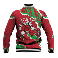 Red baseball jacket with Welsh flag pattern and dragon print, striped ribbed cuffs