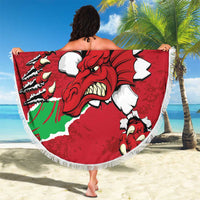 Round red Welsh dragon beach blanket with white fringe held open, showing “YOUR TEXT”.