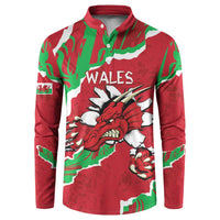 Red button sweatshirt with WALES and Welsh dragon graphic, green-and-white accents