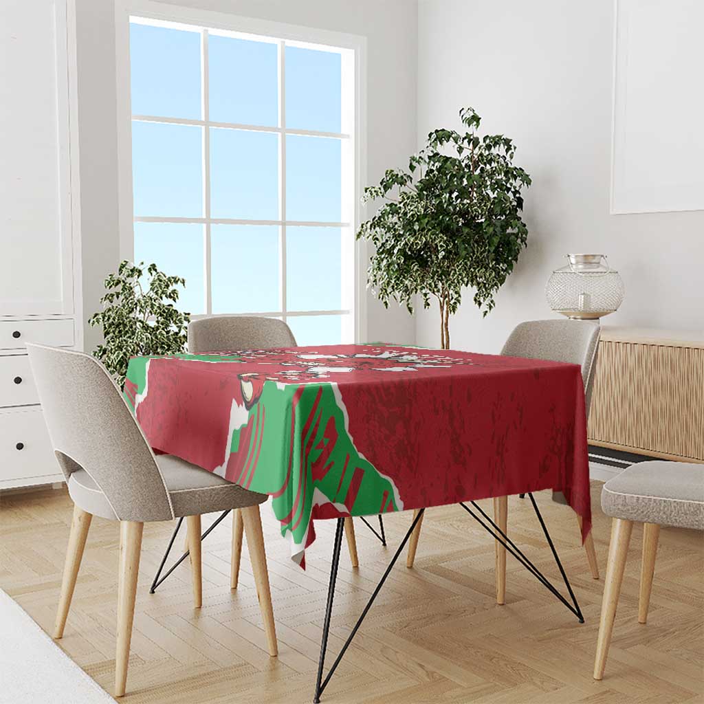 Red personalized Wales tablecloth with green dragon print draped over dining table