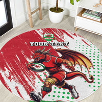 Red round rug with Welsh dragon graphic, green dots, and “YOUR TEXT” center