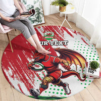 Red round rug featuring Welsh dragon mascot, green dots, and “YOUR TEXT” lettering