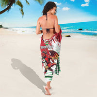 Red and white sarong with dragon mascot graphic, tied at waist