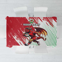 Red tablecloth with Welsh dragon mascot, green dotted pattern, and custom text panel.