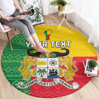 Round carpet in Benin flag style with green yellow red, crest and YOUR TEXT, hands placing it.