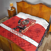 Red and white hockey quilt with beaver mascot holding trophy and 2025