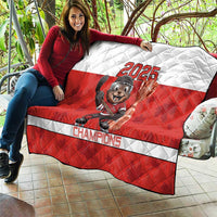 Red and white quilt blanket with 2025 beaver mascot and hockey stick graphic