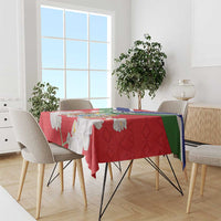 Red Gambia coat of arms tablecloth with green and blue border, on a dining table