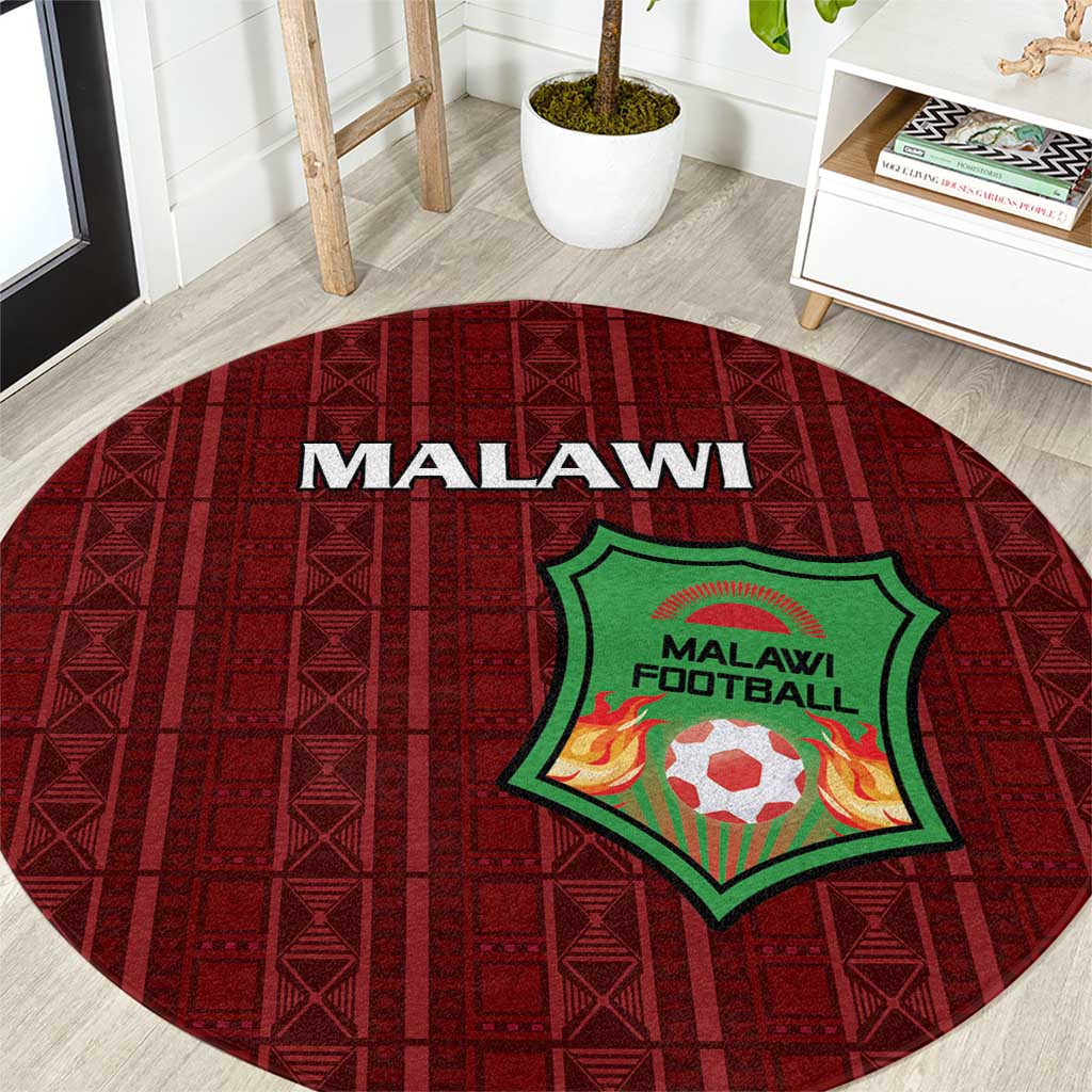 Red round carpet with 'MALAWI' text and Malawi Football crest in green, geometric pattern