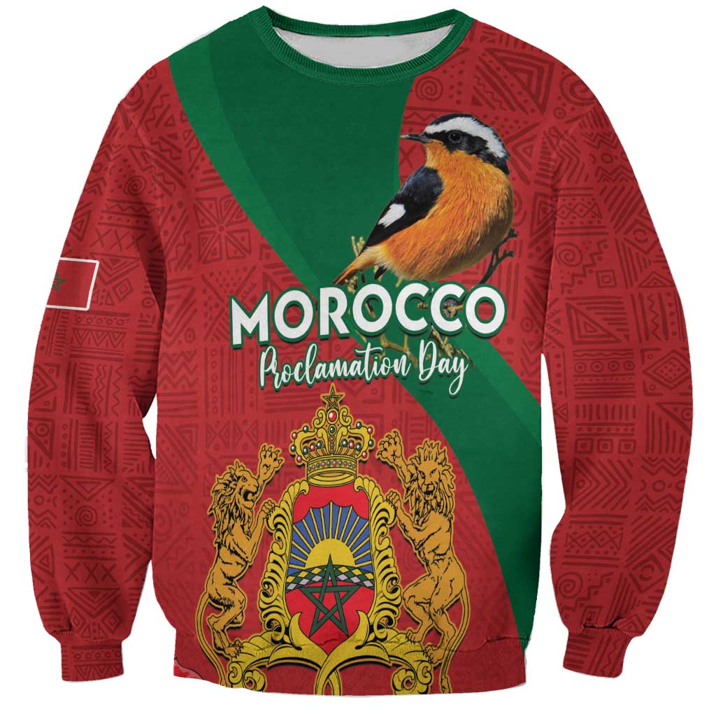 Red sweatshirt with green panels, bird graphic, Morocco Proclamation Day text, crest