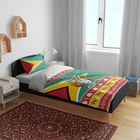 Green holiday duvet set with pillows featuring Guyana crest and Merry Christmas panel