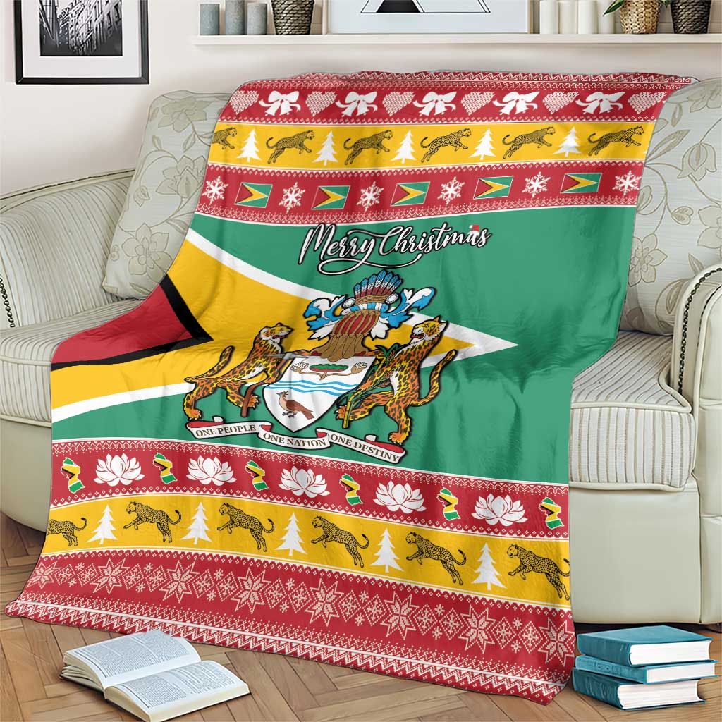 Guyana Christmas blanket on armchair with green flag center, coat of arms, and red border.