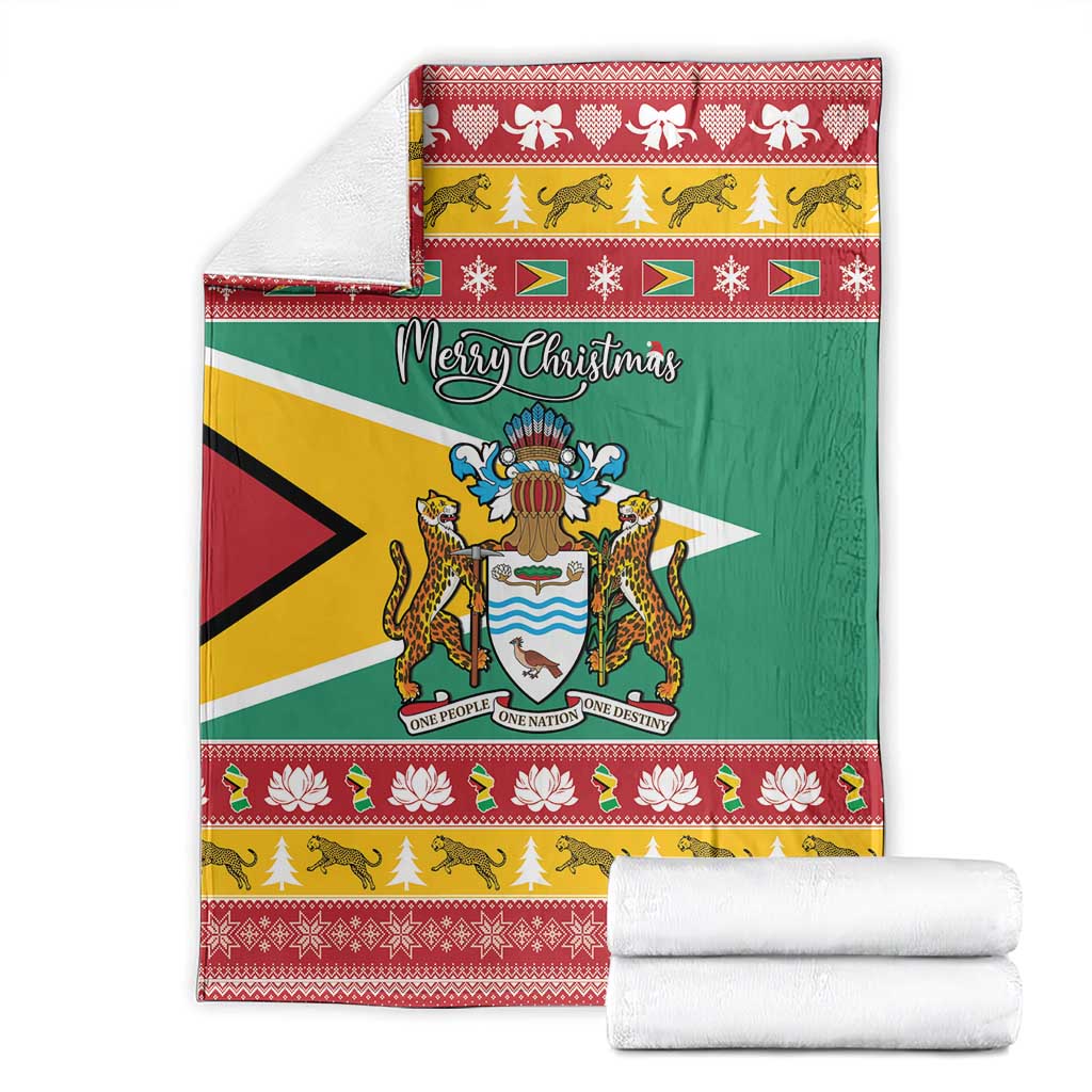 Guyana Christmas blanket folded with green flag center, coat of arms, and 'Merry Christmas'.