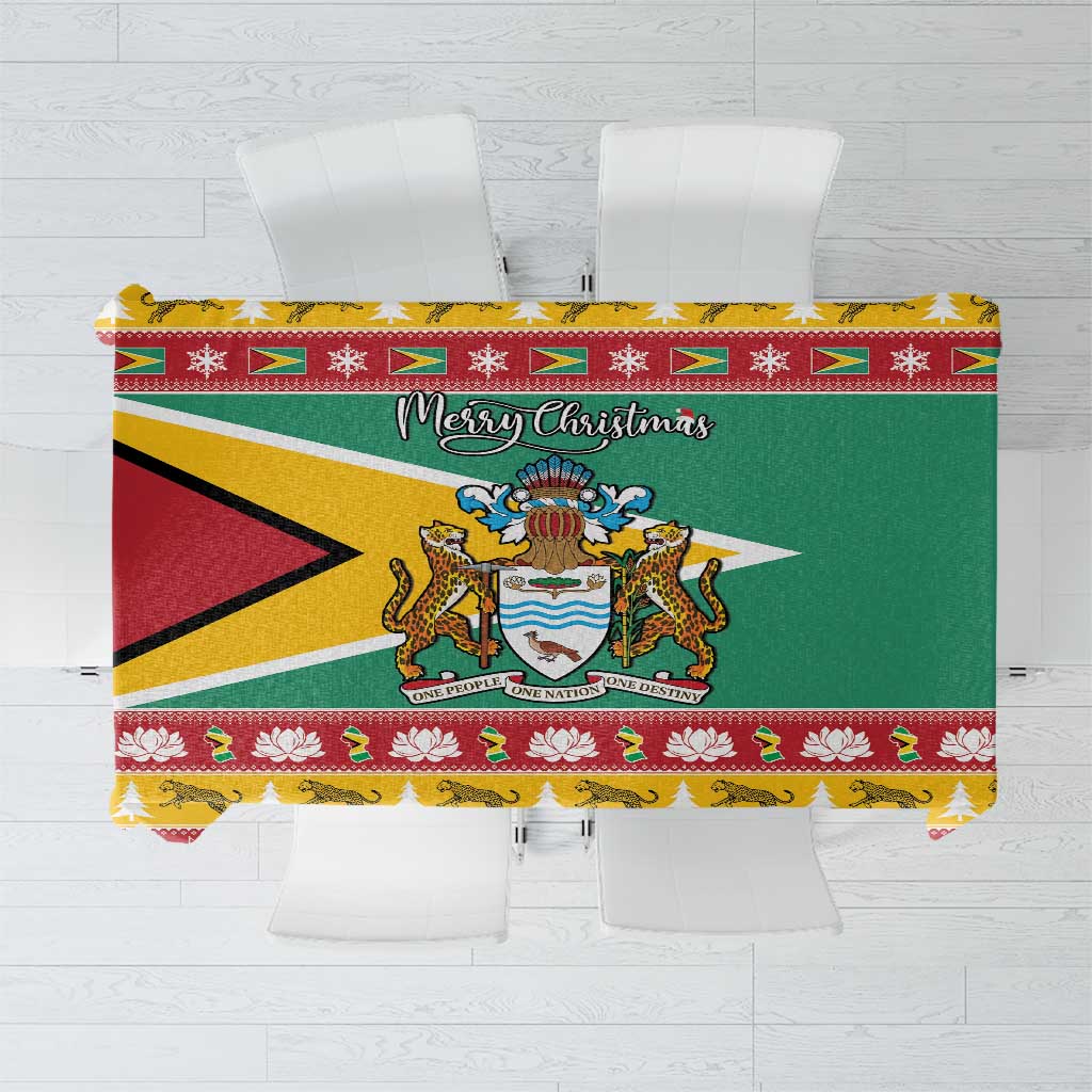 Christmas tablecloth with green Coat of Arms shield, red triangle, and “Merry Christmas” text