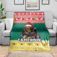 Green and yellow Cameroon blanket showing lion in Santa hat as a couch throw