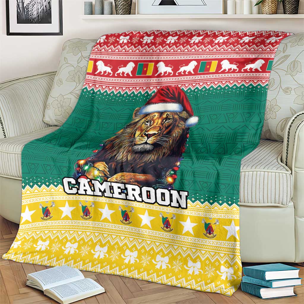 Green Christmas blanket with lion in Santa hat, 'CAMEROON' logo, and festive border